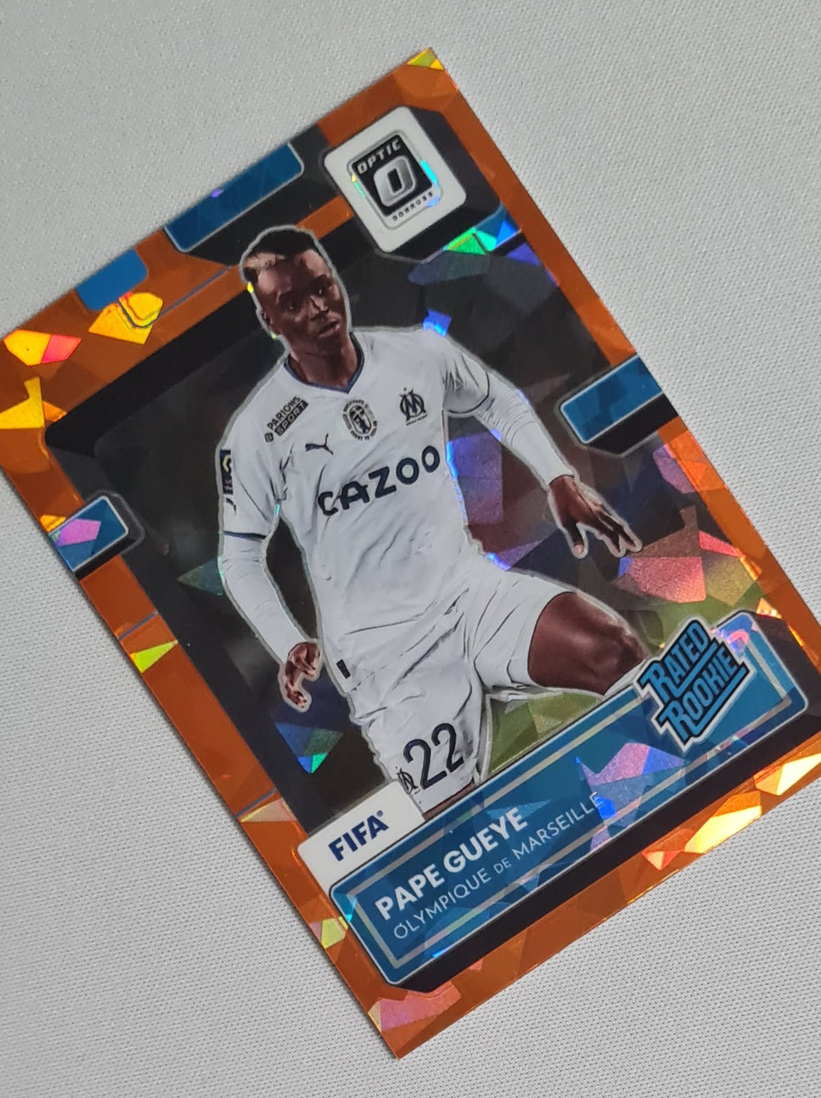 Pape Gueye - 2022/23 Panini Donruss Soccer (Rated Rookie) Olympique de Marseille #187 Orange Cracked Ice Prizm