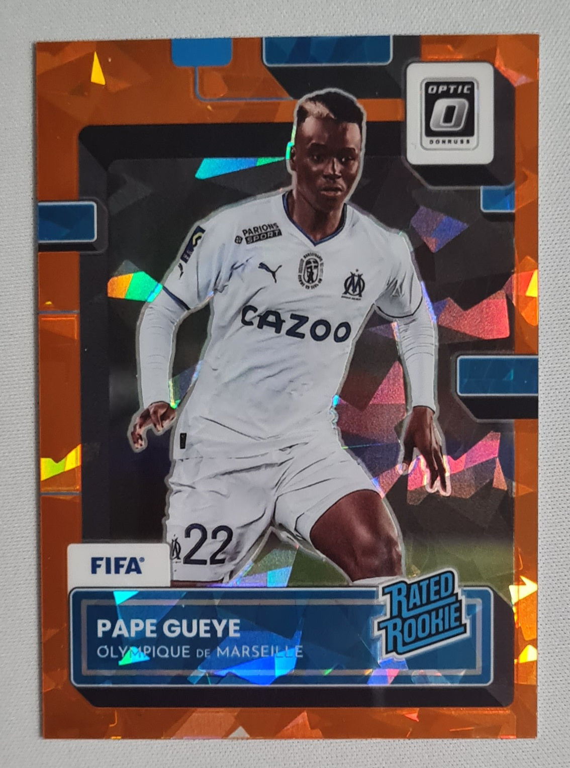 Pape Gueye - 2022/23 Panini Donruss Soccer (Rated Rookie) Olympique de Marseille #187 Orange Cracked Ice Prizm