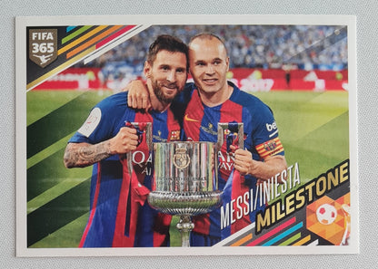 Messi/Iniesta - 2017 Panini FIFA 365 The Golden World of Football Milestone Sticker #387