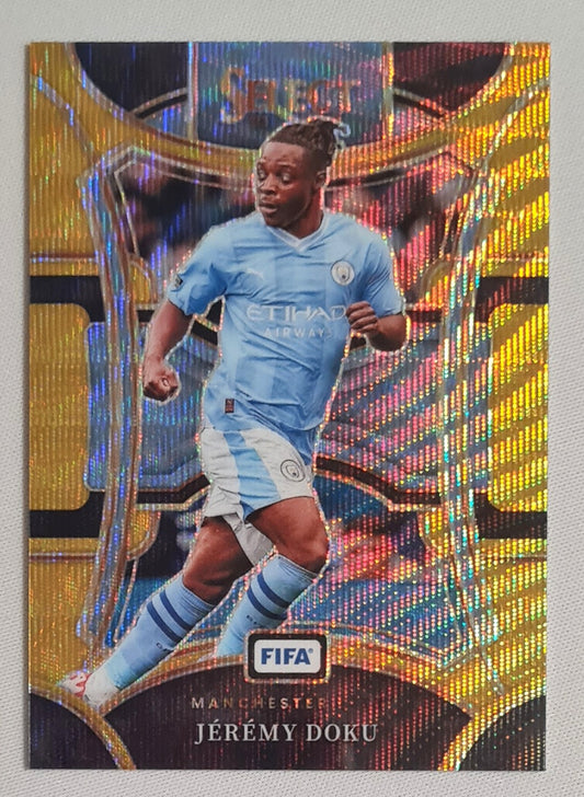 Jeremy Doku - 2023/24 Panini Select FIFA Soccer Prizm Man City #114 Mezzanine Gold Wave/10