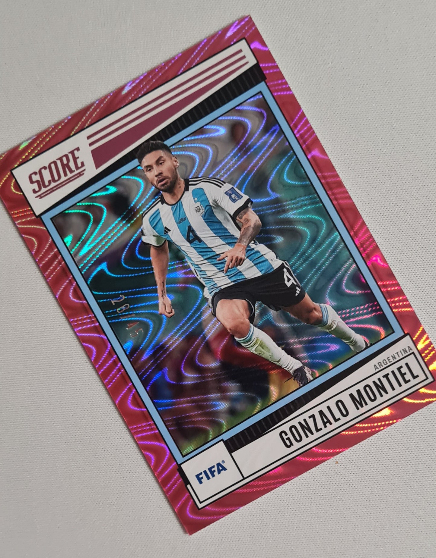 Gonzalo Montiel - 2022/23 Panini Score FIFA Soccer National Team AFA Argentina #97 Pink Swirl /45